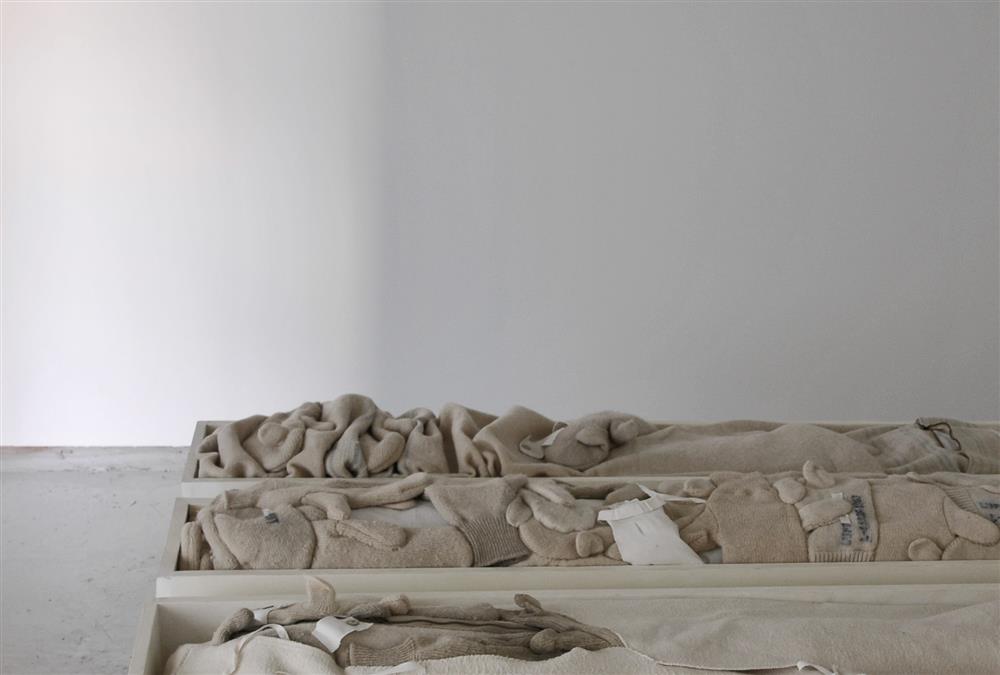 Kahb-09,Close(d),2015,17x153xca 100 (3 pieces)cm,Three  textile objects(wool mittens, quits etc)in wooden frames