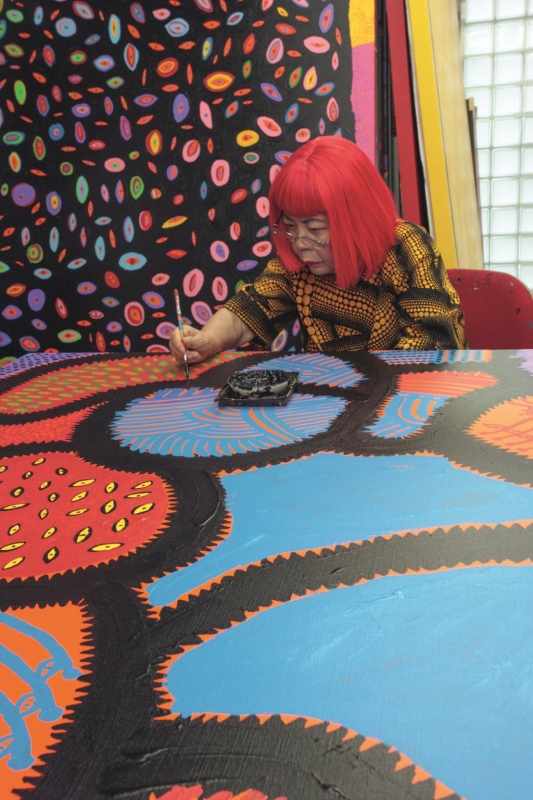 Yayoi Kusama working on 'My Eternal Soul' (2009–21), 2014. Courtesy of Ota Fine Arts and David Zwirner. © YAYOI KUSAMA
