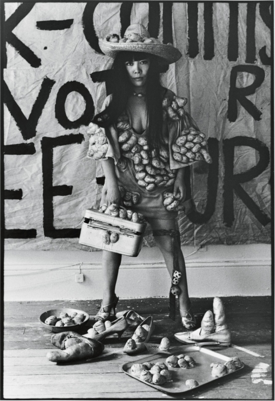 Yayoi Kusama poses in 'Untitled (Dress)' with her phallic sculptures in her New York studio, 1971. Photo: Tom Haar. © YAYOI KUSAMA